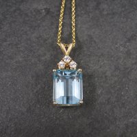 14k yellow gold blue topaz and diamond pendant necklace