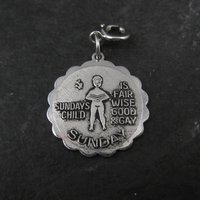 1976 Sundays Child Charm Sarah Coventry