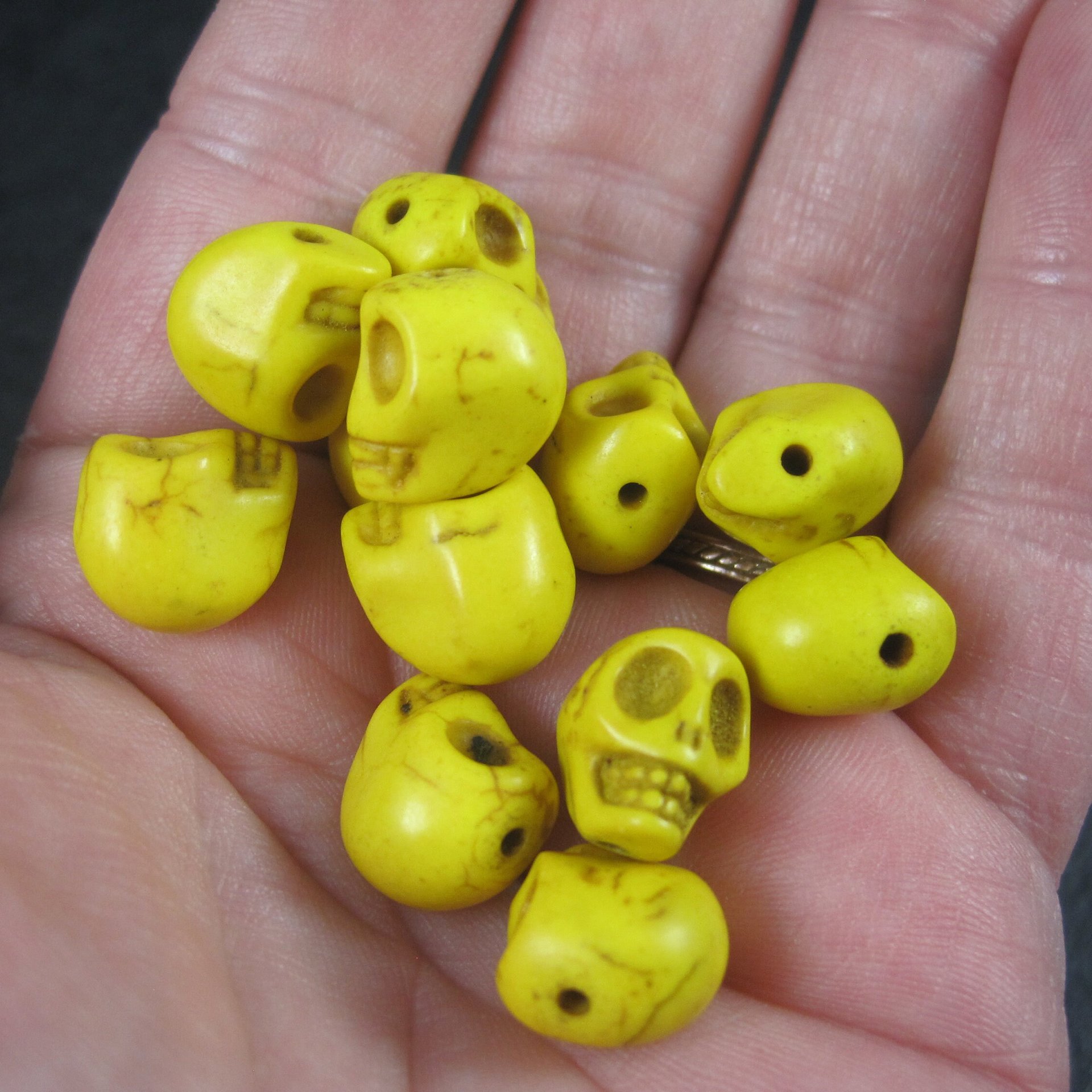 Lot of 12 Yellow Skull Beads 1/2"