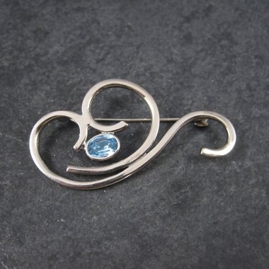 Vintage Sterling Blue Rhinestone Swirl Brooch